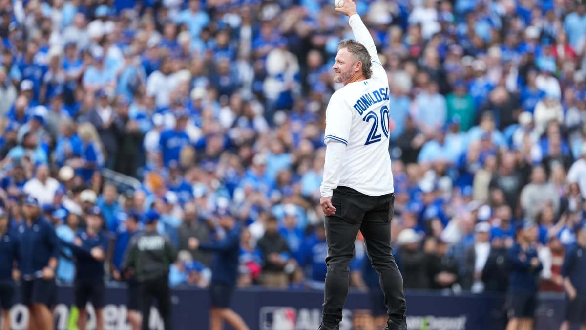 Former Toronto Blue Jays Josh Donaldson throws the first pitch before the game between the Toronto Blue Jays and Seattle Mariners during game two of the ALCS round for the 2025 MLB playoffs at Rogers Centre