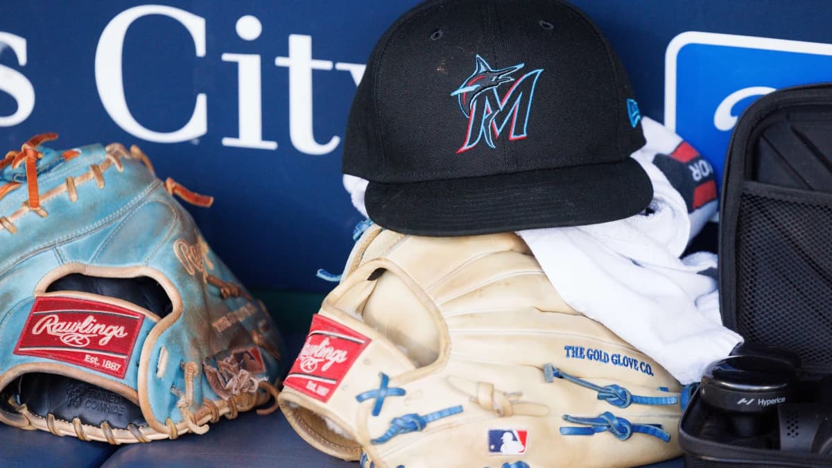 Miami Marlins hat sits in the dugout prior to the game against the Kansas City Royals at Kauffman Stadium.