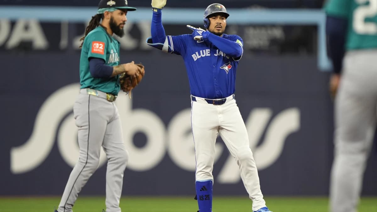 Toronto Blue Jays right fielder Anthony Santander (25) celebrates at second base in the second inning against the Seattle Mariners during game one of the ALCS round for the 2025 MLB playoffs at Rogers Centre