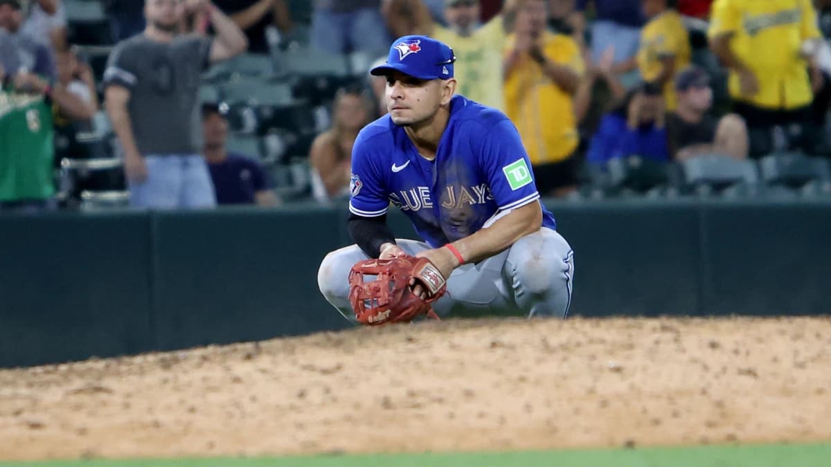 Toronto Blue Jays infielder Andres Gimenez (0) looks on while kneeling after a walk-off infield RBI single hit by Athletics infielder Jeff McNeil (not pictured) during the ninth inning at Sutter Health Park.