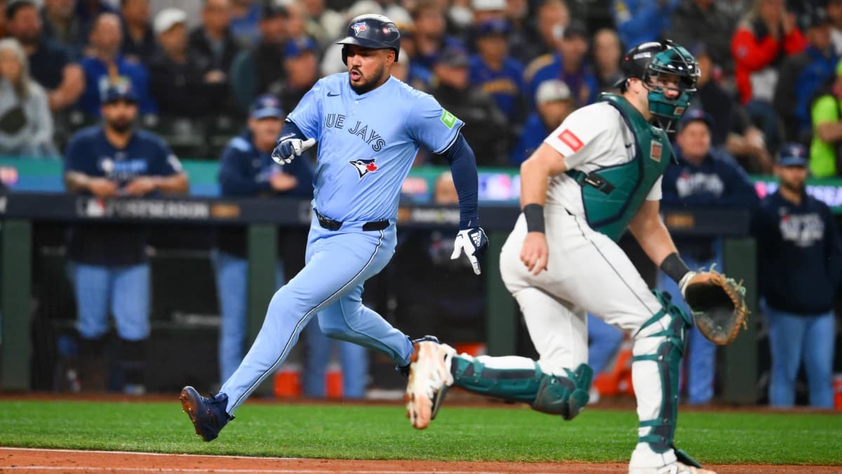 Toronto Blue Jays right fielder Anthony Santander (25) scores on a single from Toronto Blue Jays second baseman Ernie Clement (22) (not pictured) during the fifth inning against the Seattle Mariners during game three of the ALCS round for the 2025 MLB playoffs at T-Mobile Park.
