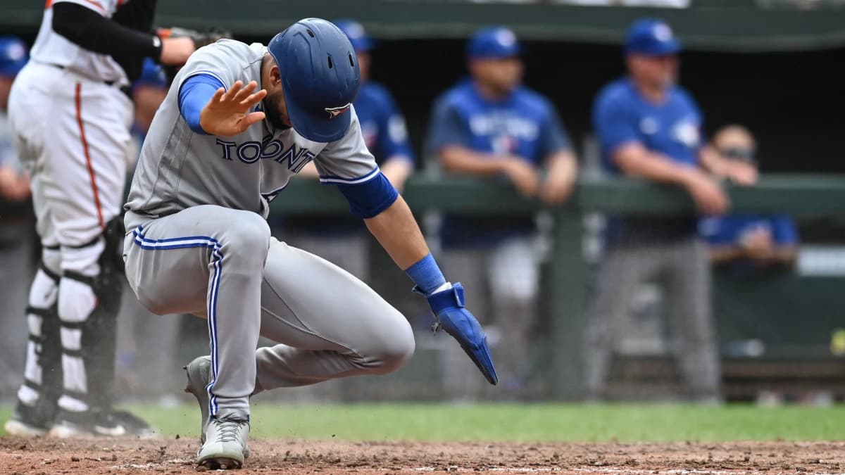 Toronto Blue Jays left fielder Lourdes Gurriel Jr. (13) slides to score during the ninth inning against the Baltimore Orioles at Oriole Park at Camden Yards. M