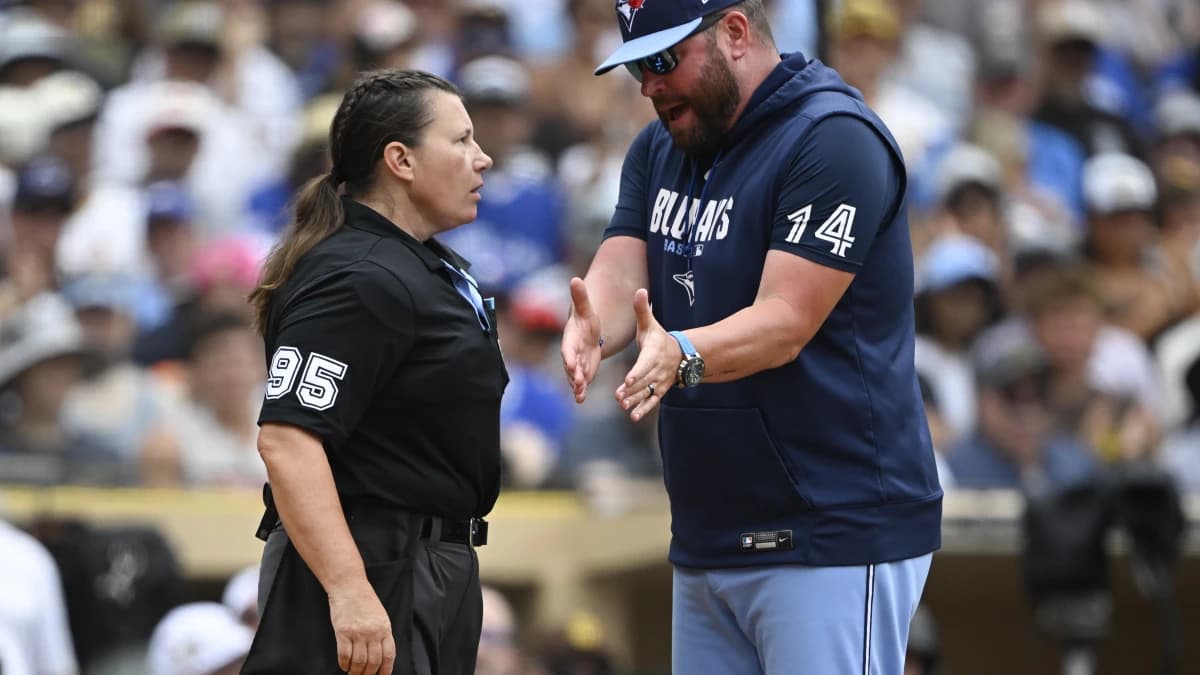 Toronto Blue Jays manager John Schneider (14) argues with home plate umpire Jen Pawol (95) during the second inning against the San Diego Padres at Petco Park.
