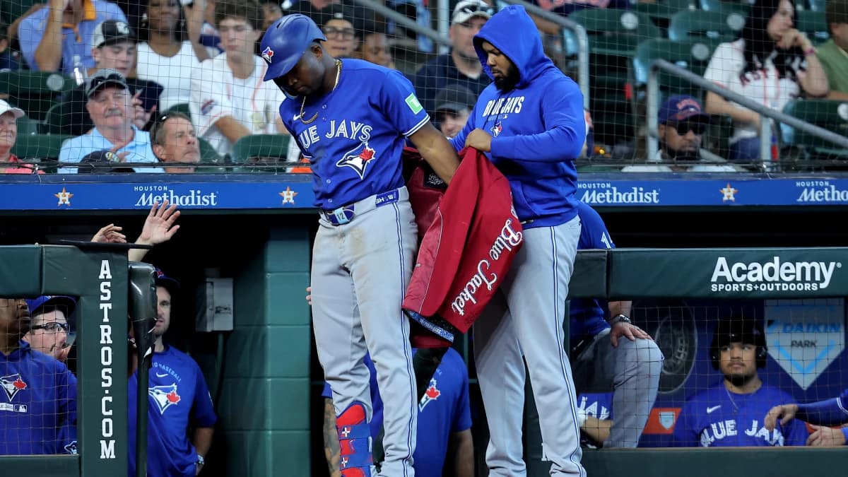 Toronto Blue Jays left fielder Jesus Sanchez (12) is greeted by Toronto Blue Jays first baseman Vladimir Guerrero Jr. (27) after hitting a two-run home run to right field against the Houston Astros during the sixth inning at Daikin Park