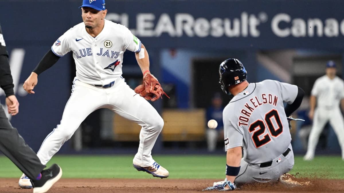 Detroit Tigers first baseman Spencer Torkleson (20) steals second base as Toronto Blue Jays shortstop Andres Gimenez (0) misses the ball in the sixth inning at Rogers Centre.