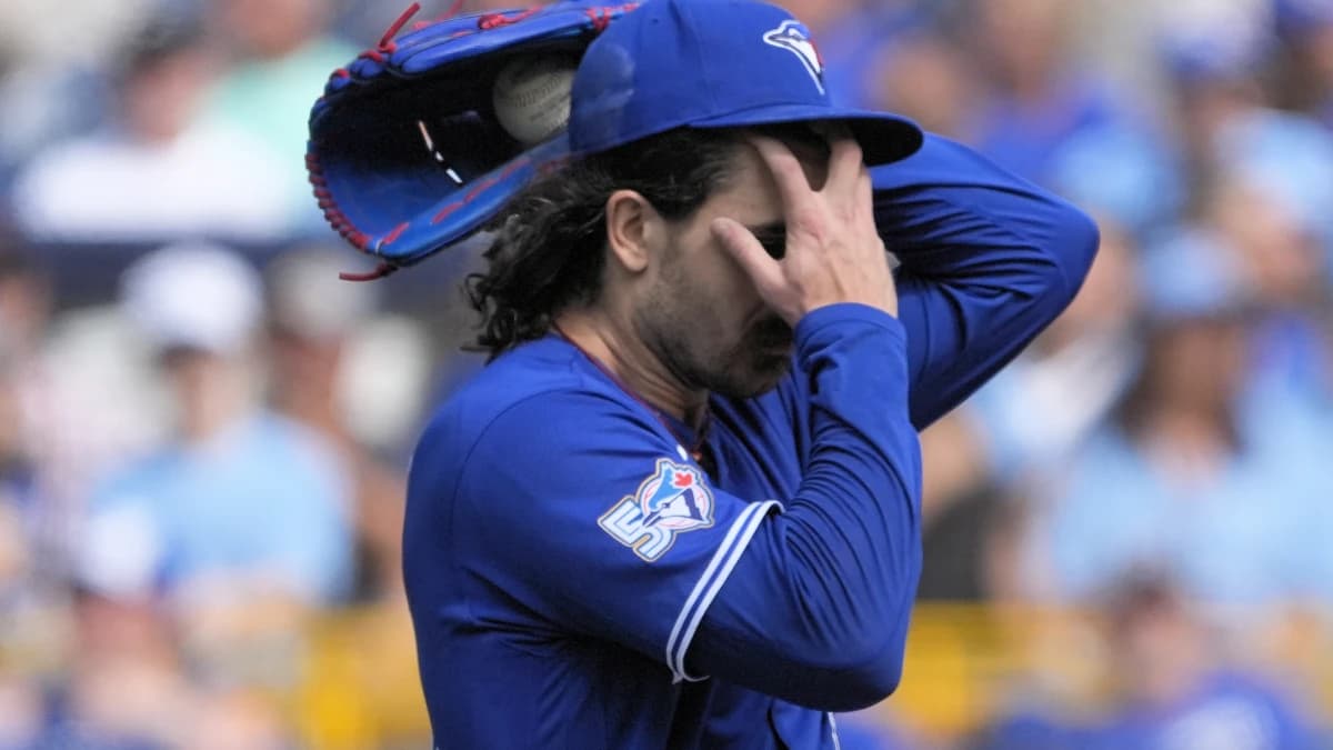Toronto Blue Jays starting pitcher Dylan Cease (84) wipes his forehead after walking several Baltimore Orioles batters during the first inning at Rogers Centre