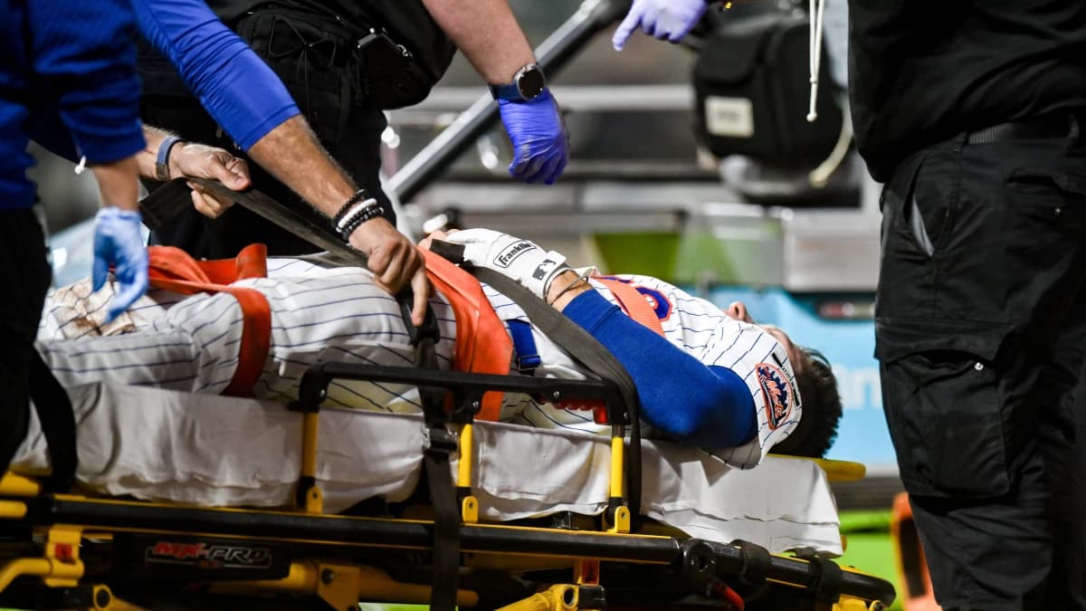 New York Mets first baseman Jared Young (29) receives medical attention after an injury at first base during the sixth inning against the Philadelphia Phillies at Citi Field.