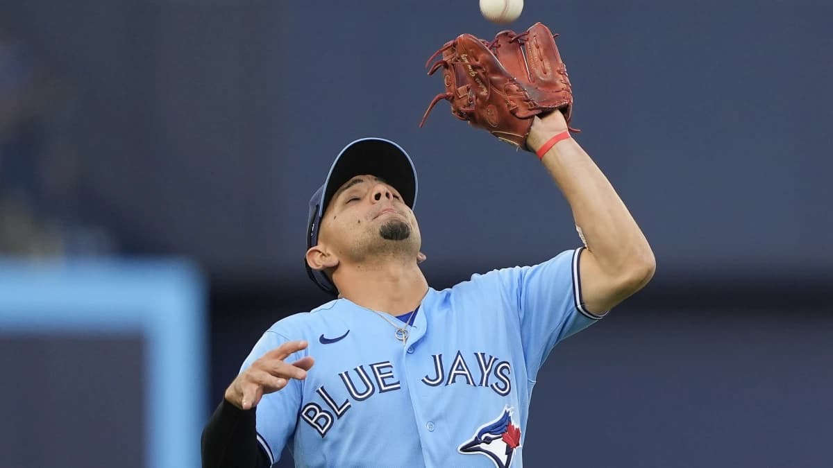 Toronto Blue Jays shortstop Andres Gimenez (0) catches a fly ball hit by Kansas City Royals shortstop Bobby Witt (not pictured)during the first inning at Rogers Centre.