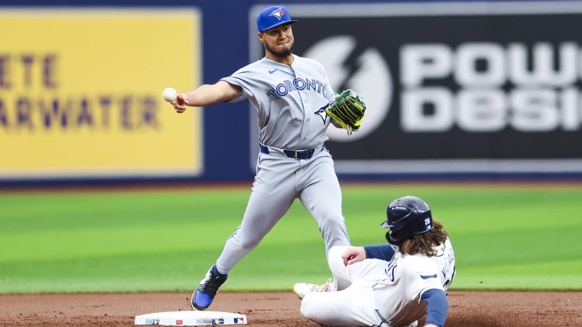 Toronto Blue Jays second baseman Lenyn Sosa (50) turns a double play against the Tampa Bay Rays in the first inning at Tropicana Field.