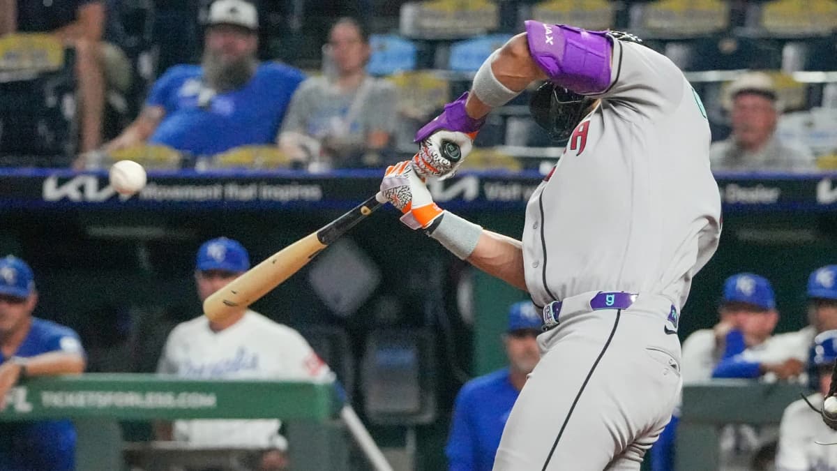 Arizona Diamondbacks left fielder Lourdes Gurriel Jr. (12) hits a one-run triple against the Kansas City Royals during the eleventh inning at Kauffman Stadium.