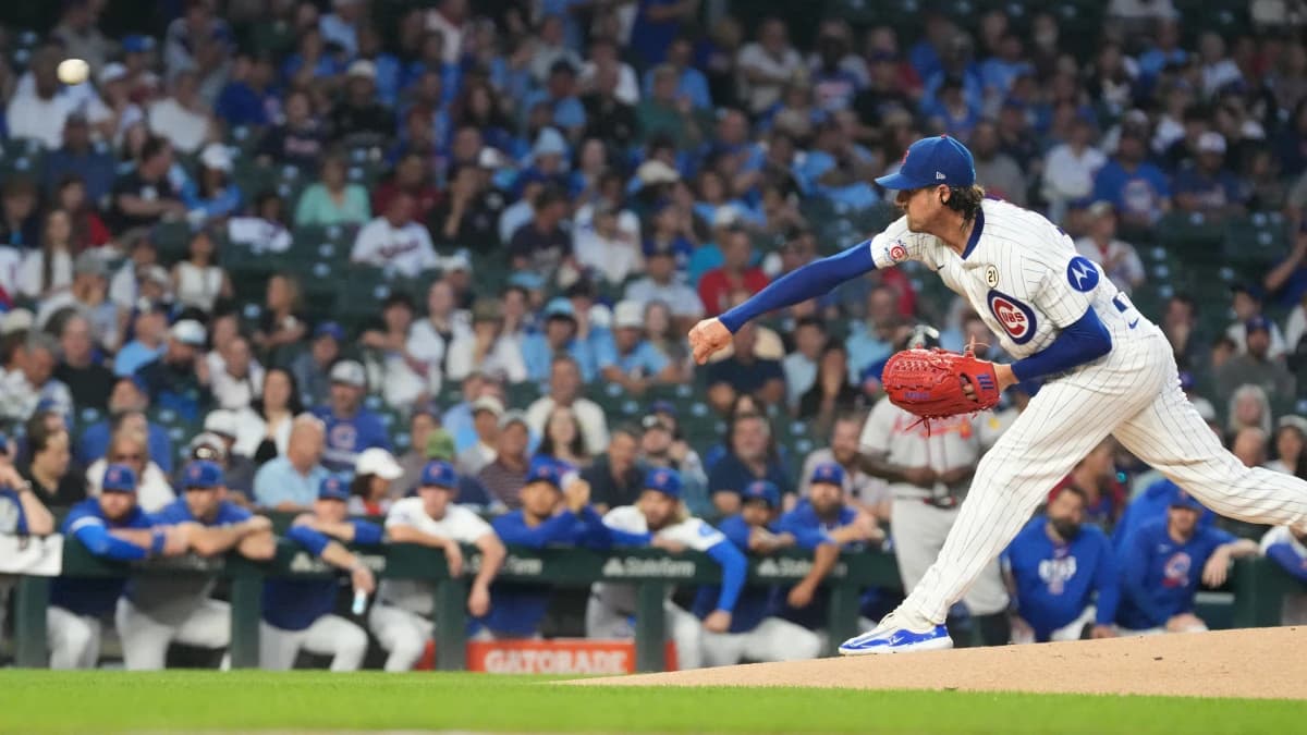 Chicago Cubs pitcher Kevin Gausman (12) throws the ball against the Atlanta Braves during the first inning at Wrigley Field