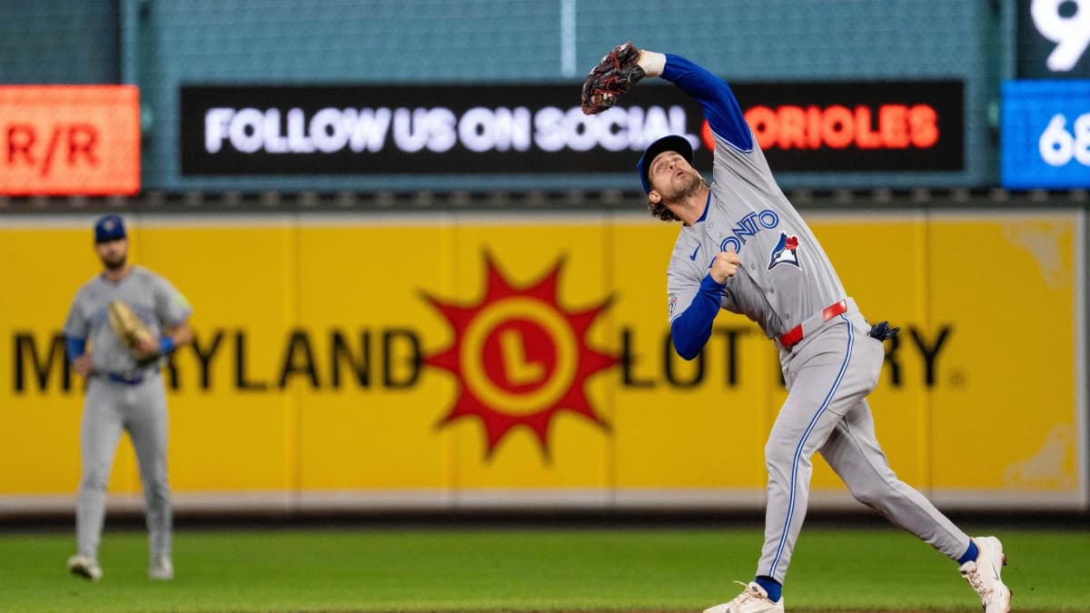 Toronto Blue Jays infielder Ernie Clement (22) catches an infield fly during the eighth inning at Oriole Park at Camden Yards