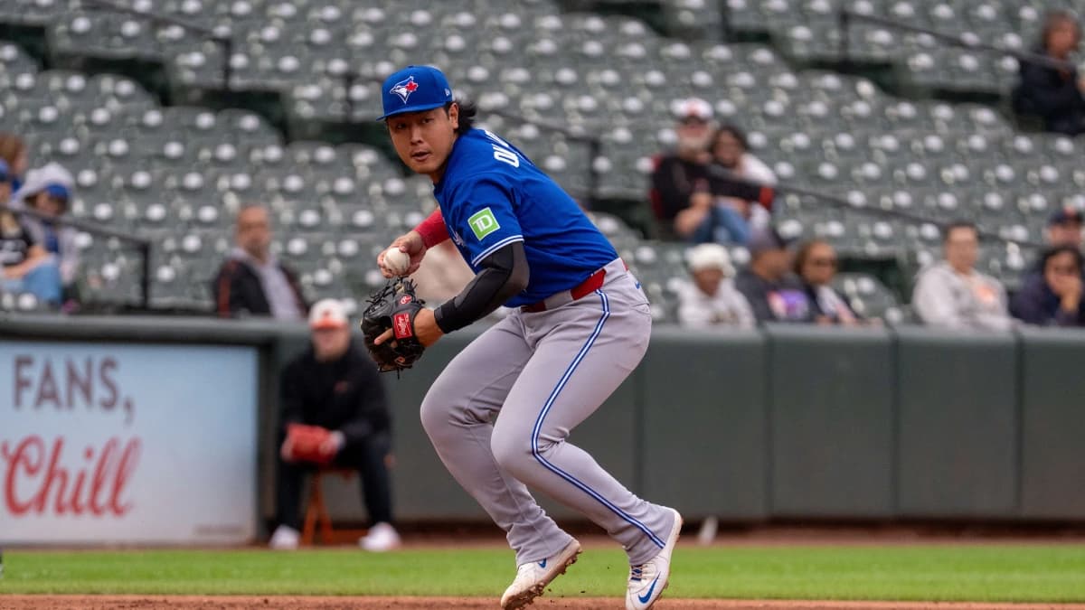 Toronto Blue Jays infielder Kazuma Okamoto (7) fields a ground ball during the seventh inning at Oriole Park at Camden Yards.