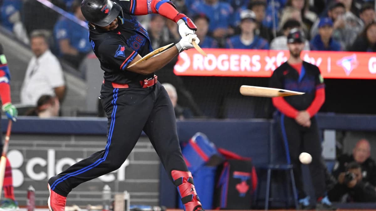 Toronto Blue Jays first baseman Vladimir Guerrero Jr. (27) breaks his bat as he hits a single against the Cincinnati Reds in the seventh inning at Rogers Centre.