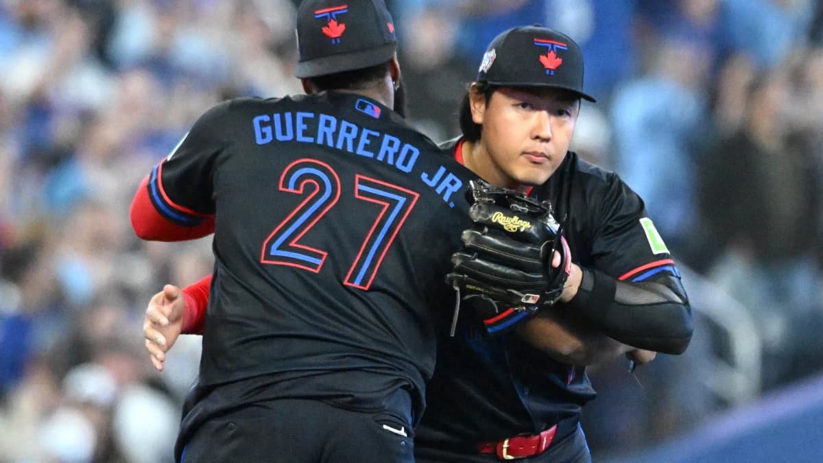 Toronto Blue Jays third baseman Kazuma Okamoto (7) celebrates with first baseman Vladimir Guerrero Jr. (27) after a win over the Cincinnati Reds at Rogers Centre.