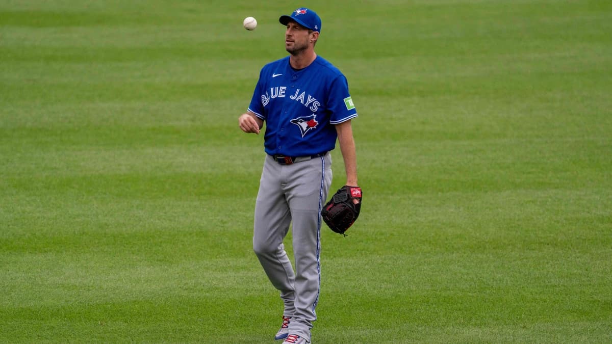Toronto Blue Jays pitcher Max Scherzer (31) tosses the ball before the game at Oriole Park at Camden Yards.