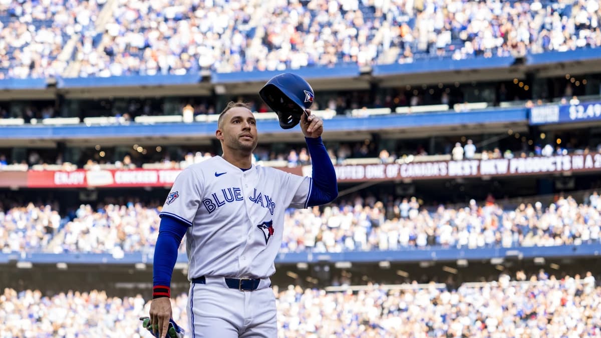 Toronto Blue Jays designated hitter George Springer (4) waves to the fans after being replaced in the during the third inning against the Cincinnati Reds at Rogers Centre.
