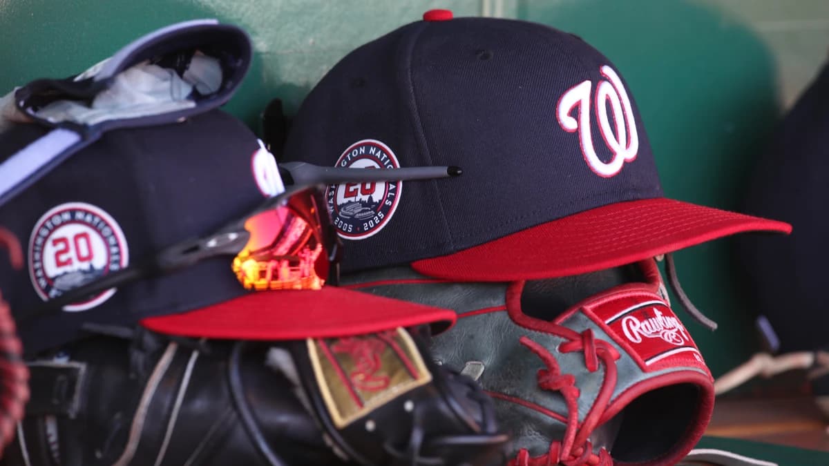 Washington Nationals hats and gloves in the dugout against the Pittsburgh Pirates during the sixth inning at PNC Park.
