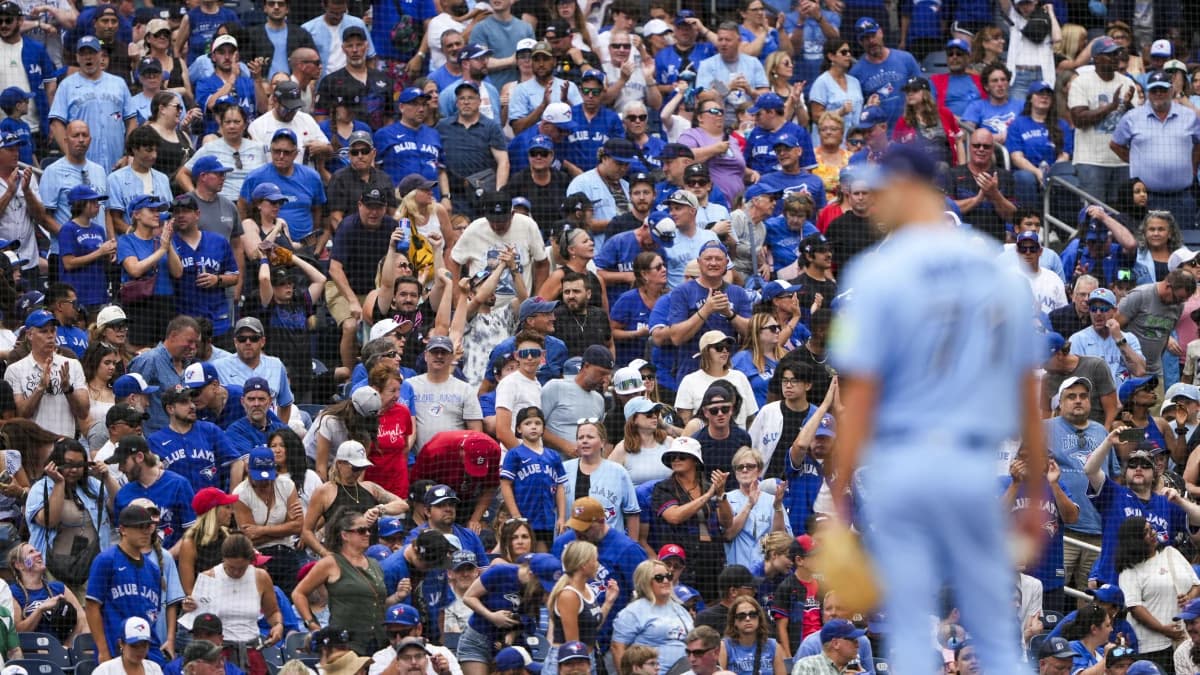 Toronto Blue Jays fans cheer on as Toronto Blue Jays pitcher Tyler Rogers (71) pitches against the St. Louis Cardinals during the ninth inning at Rogers Centre