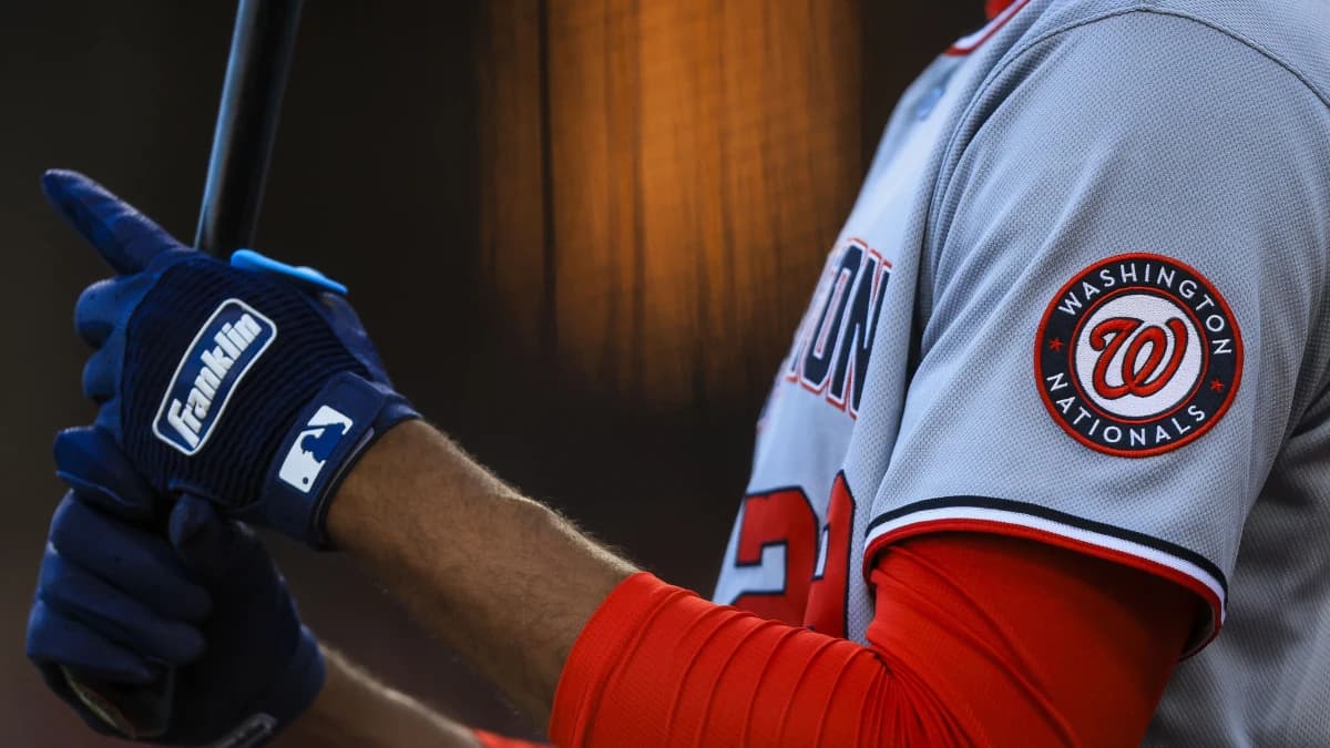 The Washington Nationals logo on the sleeve of outfielder James Wood (29) as he prepares on deck in the fourth inning against the Cincinnati Reds at Great American Ball Park.