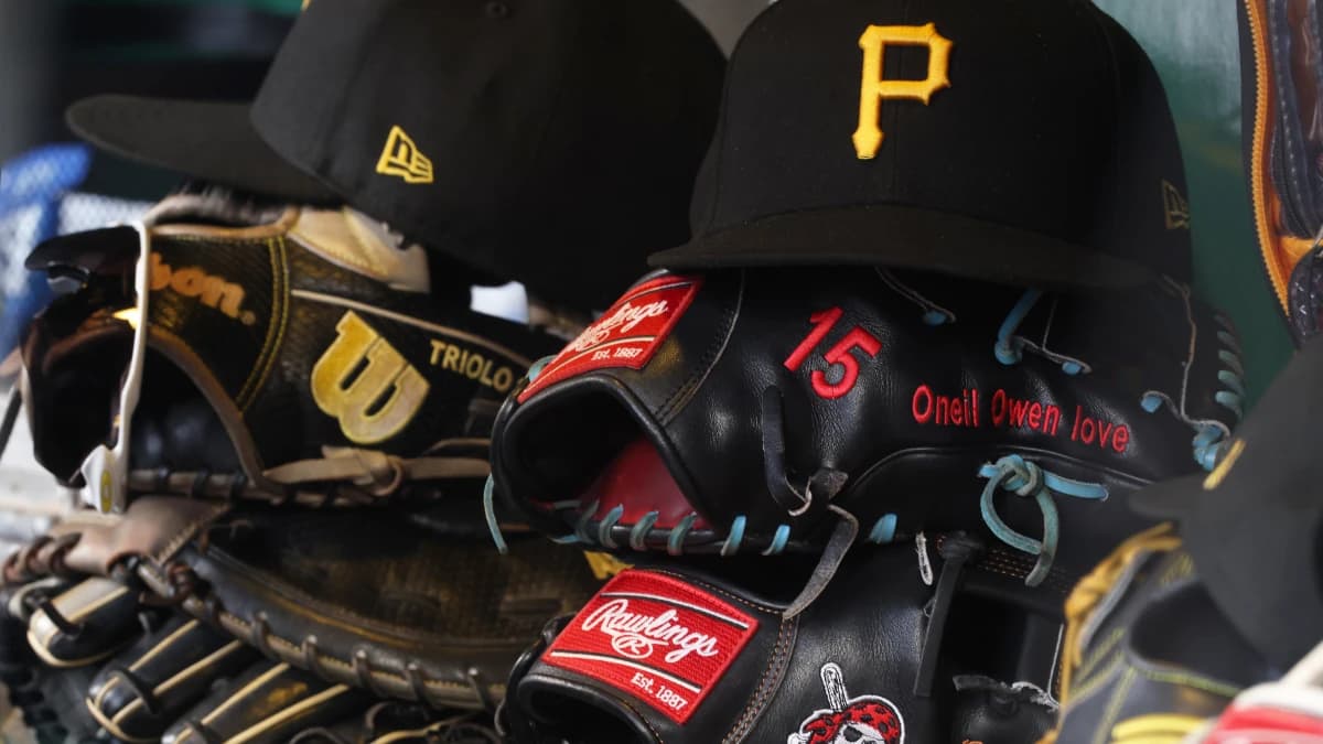 Hats and gloves belonging to Pittsburgh Pirates infielder Jared Triolo (not pictured) and center fielder Oneil Cruz (not pictured) in the dugout during the seventh inning against the Kansas City Royals at PNC Park