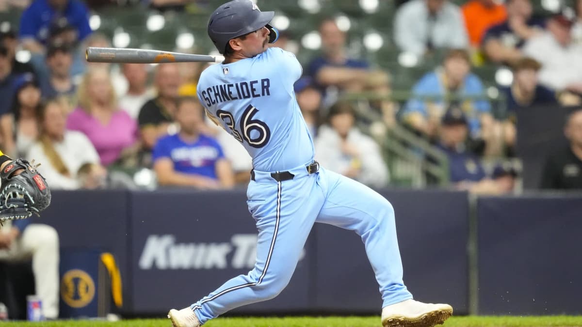 Toronto Blue Jays pinch hitter Davis Schneider (36) hits a double during the ninth inning against the Milwaukee Brewers at American Family Field