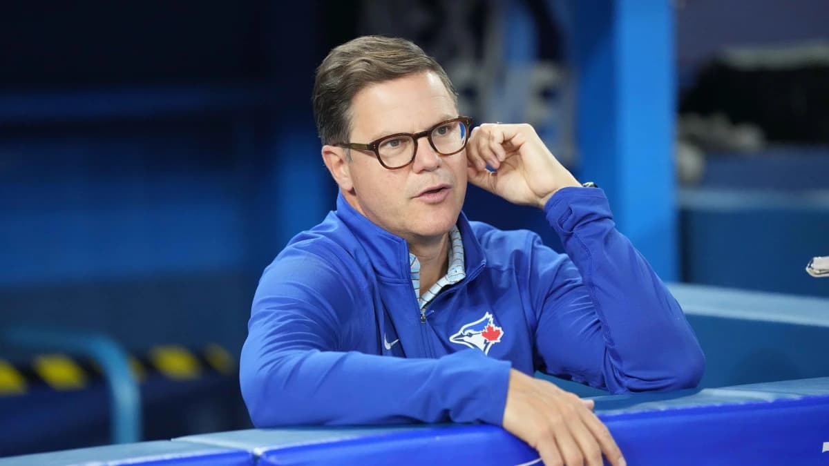 Toronto Blue Jays general manager Ross Atkins talks with the media during batting practice against the San Francisco Giants at Rogers Centre.