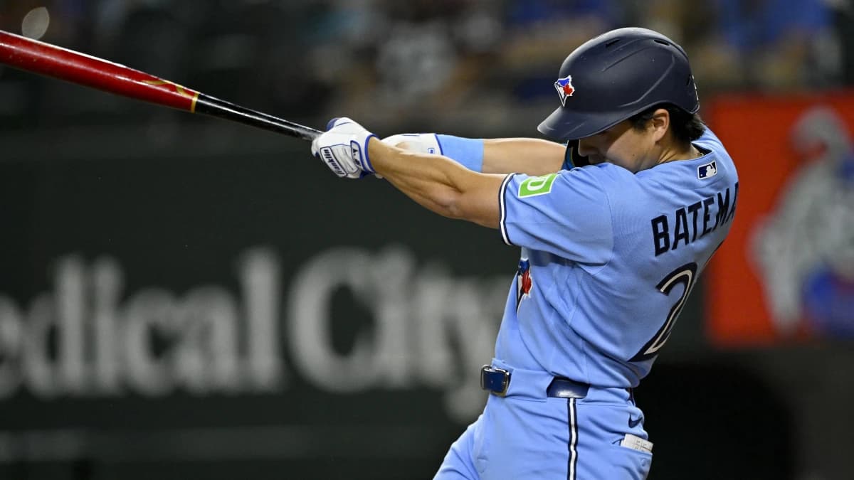 Toronto Blue Jays center fielder Brett Bateman (21) hits a single during the sixth inning against the Texas Rangers at Globe Life Field.