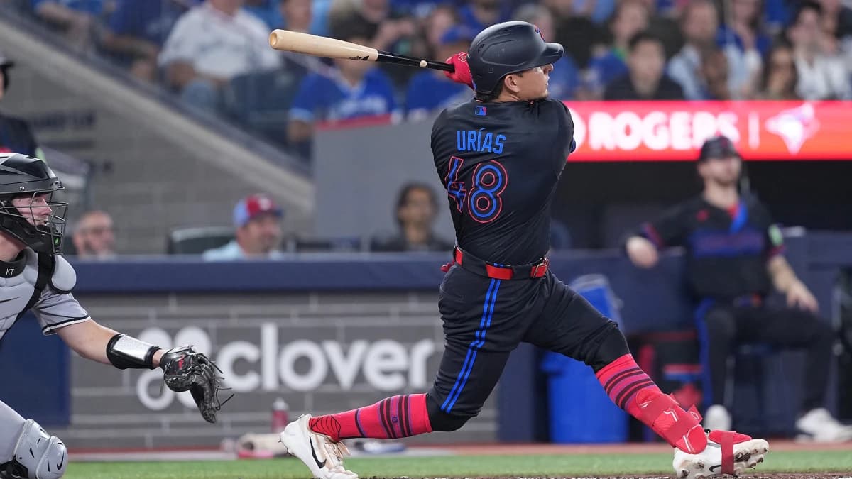 Toronto Blue Jays second baseman Luis Urias (48) hits a home run against the Chicago White Sox during the fourth inning at Rogers Centre.