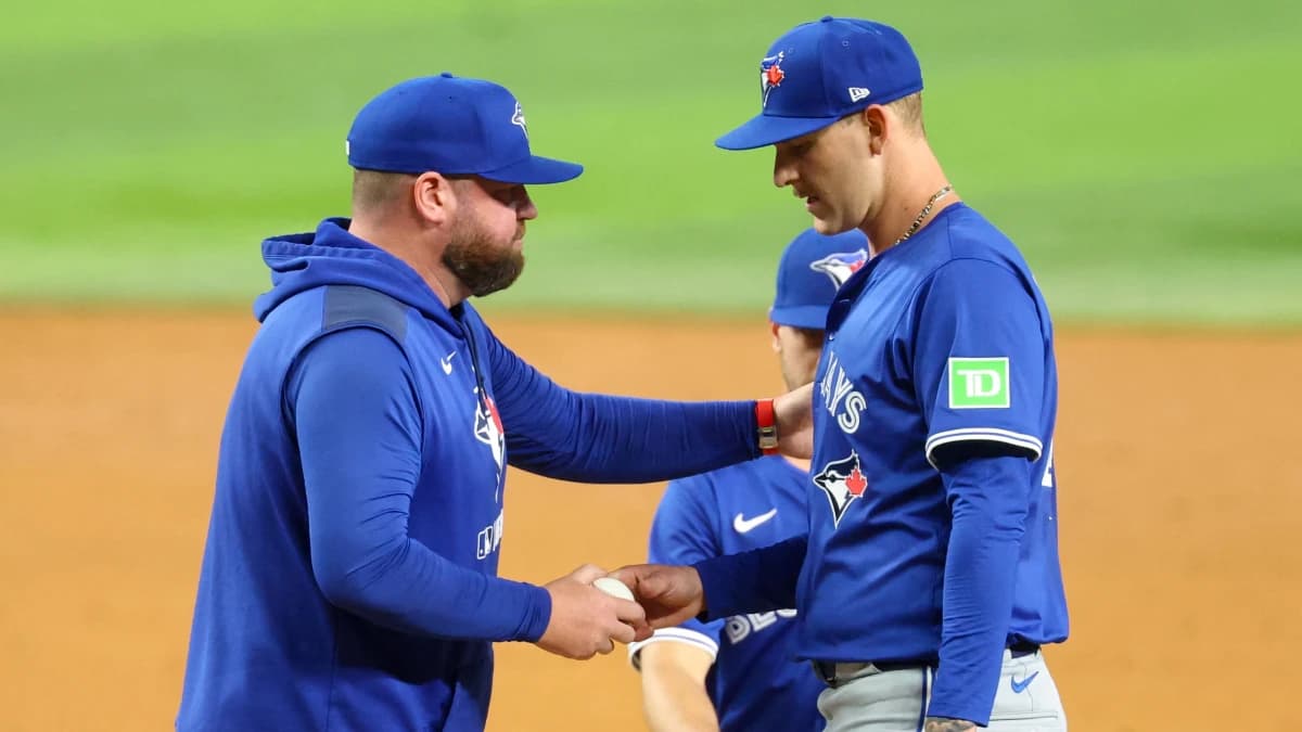 Toronto Blue Jays manager John Schneider (14) removes Toronto Blue Jays starting pitcher Bowden Francis (44) during the sixth inning against the Texas Rangers at Globe Life Field.