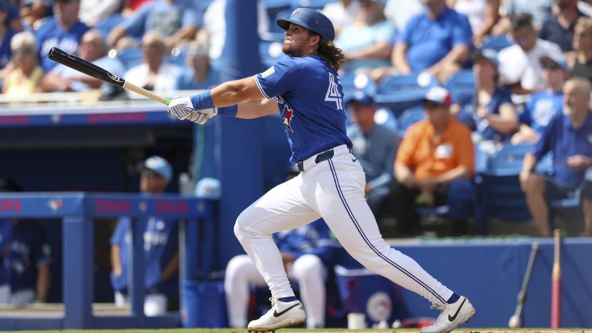 Toronto Blue Jays third baseman Addison Barger (47) hits a solo home run against the Detroit Tigers in the second inning during spring training at TD Ballpark.