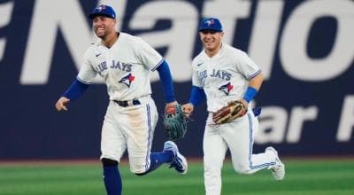 Varsho and Springer running in from the outfield.