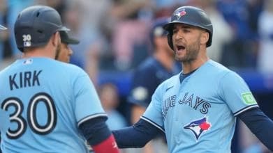 KK and Alejandro Kirk scoring a run for the Blue Jays