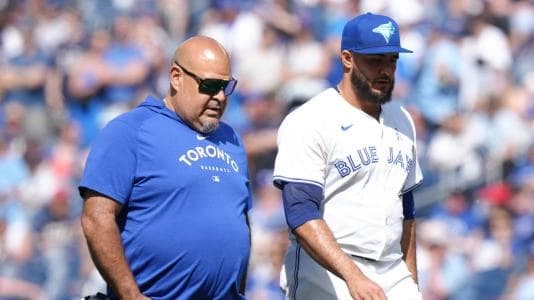 Toronto Blue Jays reliever Yimi Garcia exits the game in the 9th inning with an apparent elbow injury.