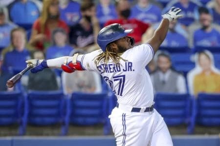 Vladimir Guerrero Jr. launching a home run at Rogers Centre.