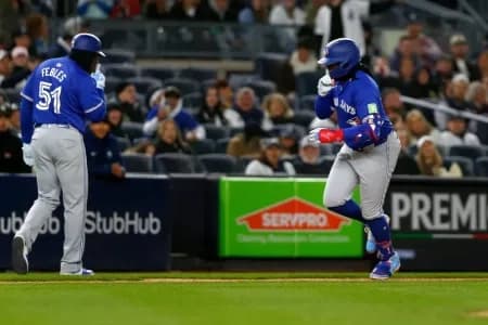 3rd Base Coach Carlos Febles and Vladimir Guerrero Jr.