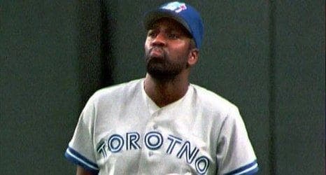 Joe Carter Wearing a Blue Jays jersey that misspelled Toronto
