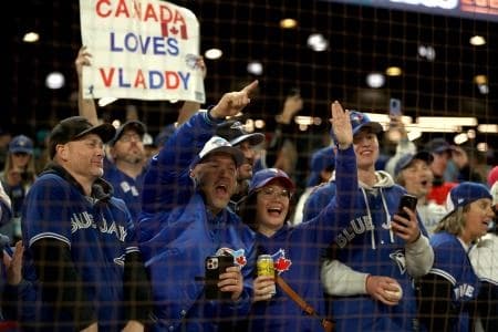 Toronto Blue Jays fans celebrate after winning game four of the ALCS round for the 2025 MLB playoffs against the Seattle Mariners at T-Mobile Park.