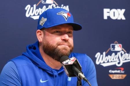 Toronto Blue Jays manager John Schneider (14) speaks at the pregame press conference before game five of the 2025 MLB World Series at Dodger Stadium.