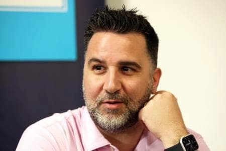 Atlanta Braves general manager and president of baseball operations Alex Anthopoulos talks with media at George M. Steinbrenner Field.