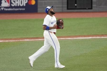 Toronto Blue Jays first baseman Vladimir Guerrero Jr. (27) reacts after a double play against the Los Angeles Dodgers in the seventh inning during game seven of the 2025 MLB World Series at Rogers Centre.