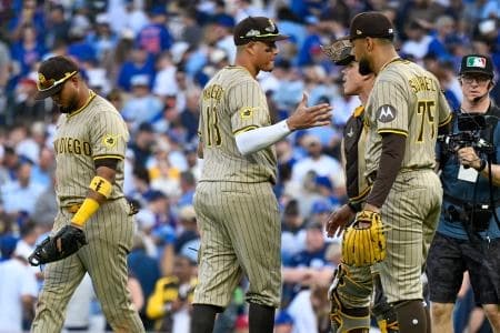 San Diego Padres relief pitcher Robert Suarez (75) celebrates with teammates after the final out for the win against the Chicago Cubs in the ninth inning during game two of the Wildcard round for the 2025 MLB playoffs at Wrigley Field.