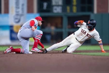 San Francisco Giants shortstop Willy Adames (2) is caught stealing second base by St. Louis Cardinals second baseman Brendan Donovan (33) during the fifth inning at Oracle Park.