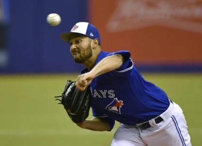 Toronto Blue Jays pitcher Danny Young (77) pitches against the St. Louis Cardinals in the eight inning at Olympic Stadium.