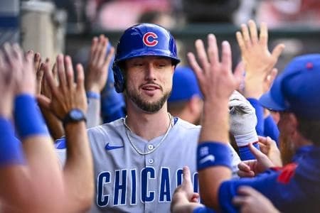 Chicago Cubs outfielder Kyle Tucker (30) celebrates with teammates after hitting a two-run home run against the Los Angeles Angels during the third inning at Angel Stadium.