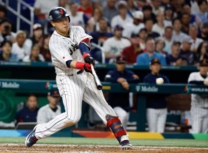 Japan first baseman Kazuma Okamoto (25) bats against the USA in the sixth inning at LoanDepot Park.