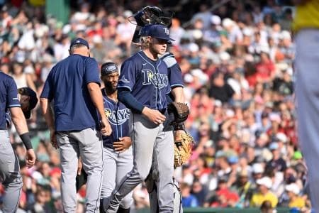Tampa Bay Rays manager Kevin Cash (16) relives starting pitcher Shane Baz (11) of pitching duties during the seventh inning against the Boston Red Sox at Fenway Park.