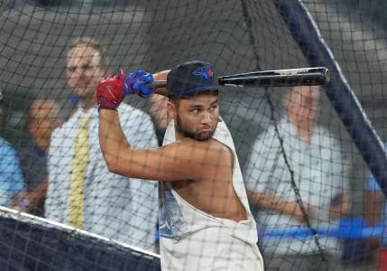 Toronto Blue Jays shortstop Bo Bichette (11) takes batting practice before a game against the Chicago Cubs at Rogers Centre.
