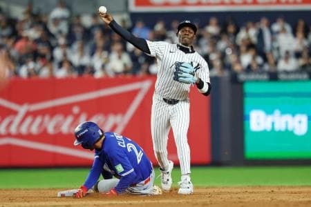New York Yankees second baseman Jazz Chisholm Jr. (13) forces out Toronto Blue Jays third baseman Ernie Clement (22) and tries to turn a double play during the eighth inning during game four of the ALDS round for the 2025 MLB playoffs at Yankee Stadium.