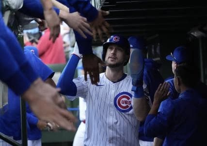 Chicago Cubs designated hitter Kyle Tucker (30) celebrates with teammates after scoring during the second inning against the San Diego Padres during game three of the Wildcard round for the 2025 MLB playoffs at Wrigley Field